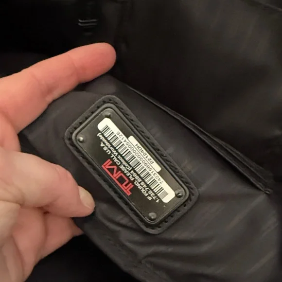 Tumi black travel bag/carryon